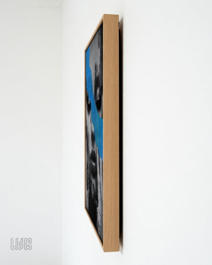 Contemporary acrylic portrait painting featuring a monochromatic female face crossed by a flowing blue abstract form, symbolizing emotion, healing, and self-reflection in premium wall art frames.